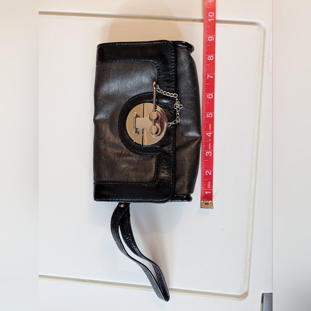 The Limited Black Leather Clutch with Minimalist Design